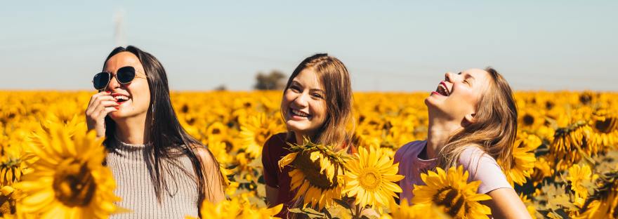 3 young women laughing