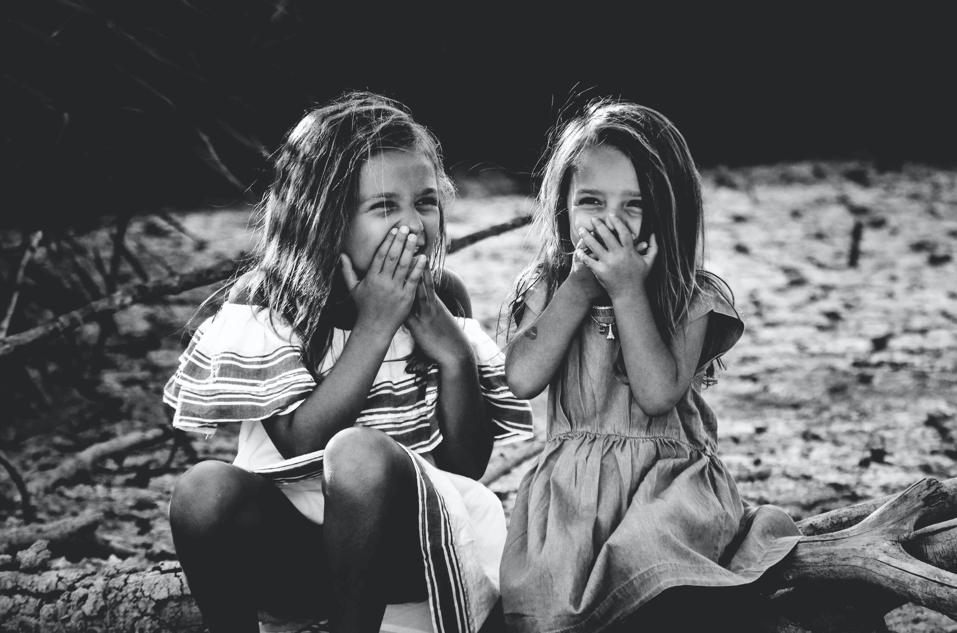 little girls laughing together